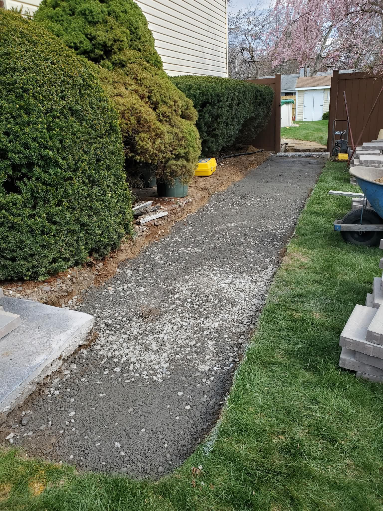 Start: Slate walkway area excavated between fences