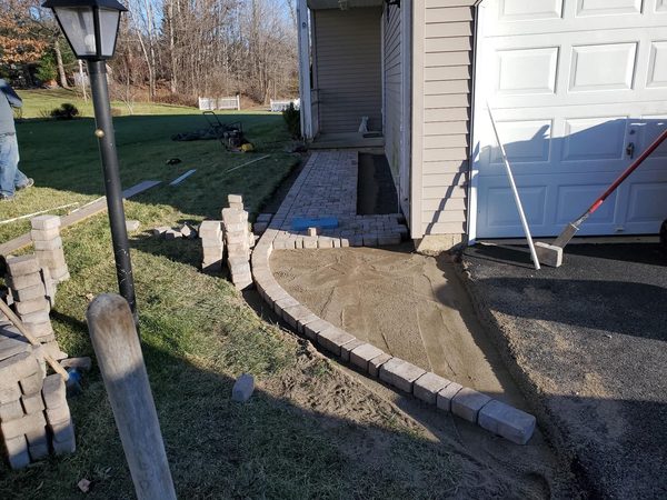 Fan pattern being laid at walkway junction