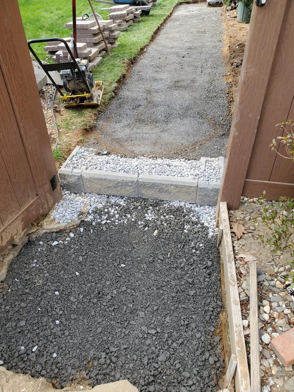 Gravel base prepared for slate walkway