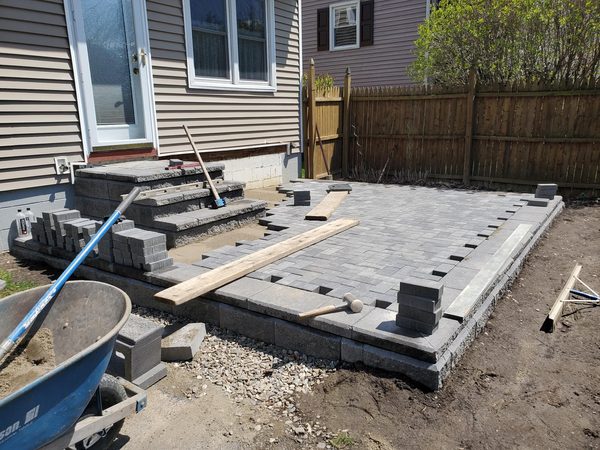 Herringbone pavers being installed