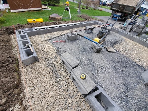 Gravel fill inside retaining wall frame