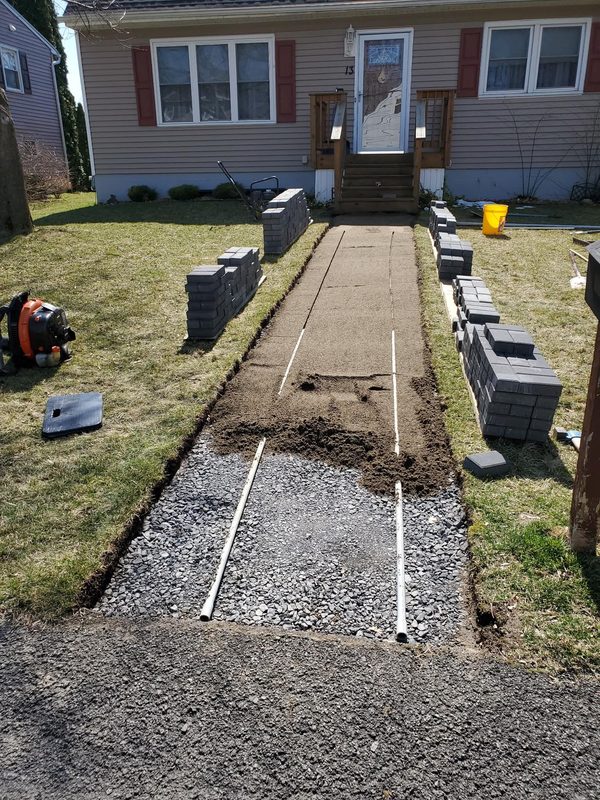 Excavation and gravel base prep for front walkway