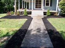 Walkway with mulch beds and plantings